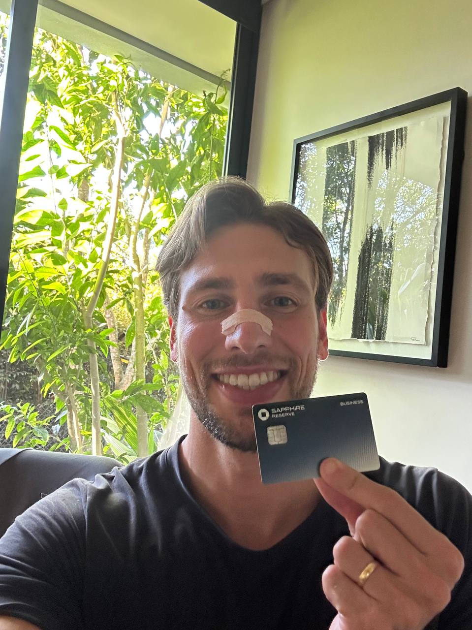 Client holding his Chase Sapphire Reserve for Business card