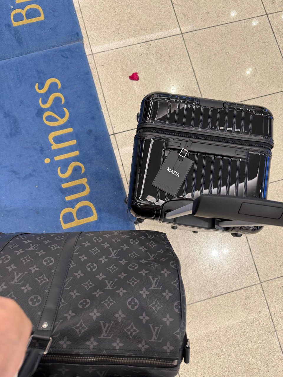 Her luggage at business class check-in